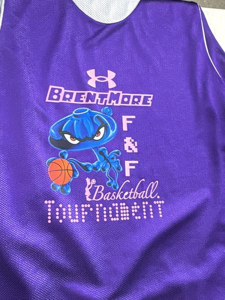 Purple reversible mesh basketball jersey with a full-color mascot and pink Brentmore F&F Basketball Tournament lettering