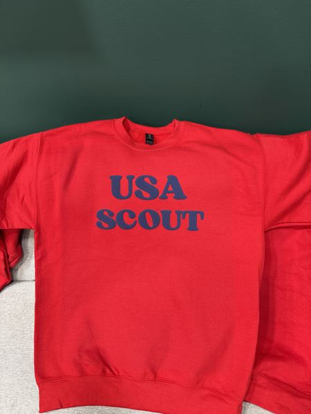 Navy print on a red crewneck sweatshirt reading USA SCOUT